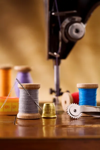 Small sewing wooden bobbin with other items