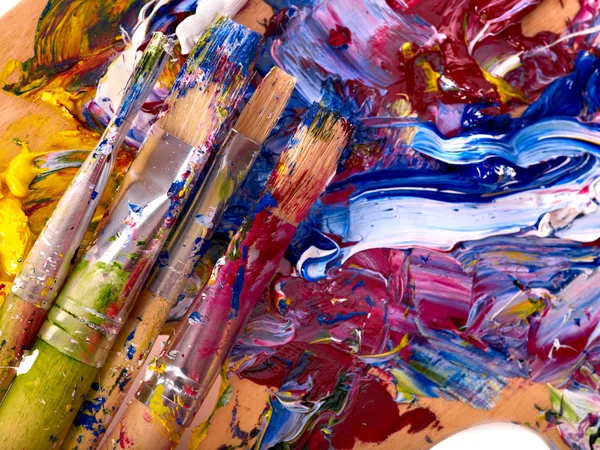 Close up of paint mixed on palette.