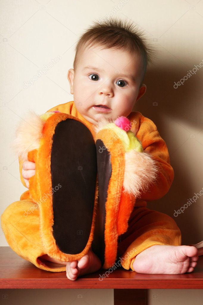 toddler toddler  slippers boy boy Stock  hand. and Cute slippers  sitting for holding in   baby