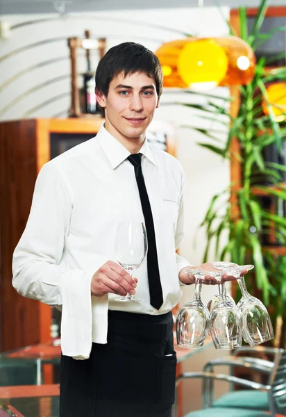 Waiter in uniform at restaurant