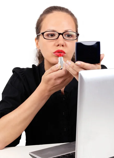 Businesswoman with red lipstick and mirror