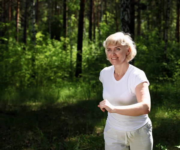 Elderly woman likes to run in the park — Stock Photo #6044258