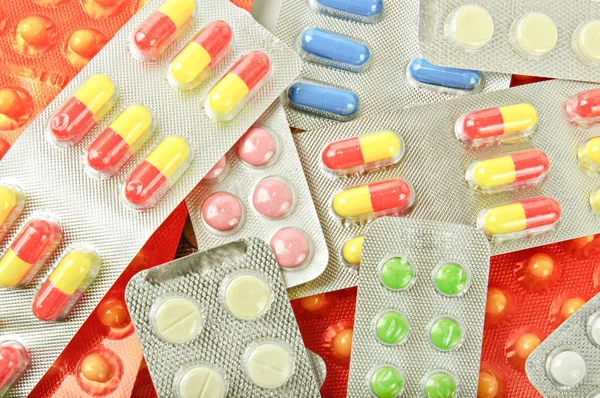 Multicolored medicine pills background