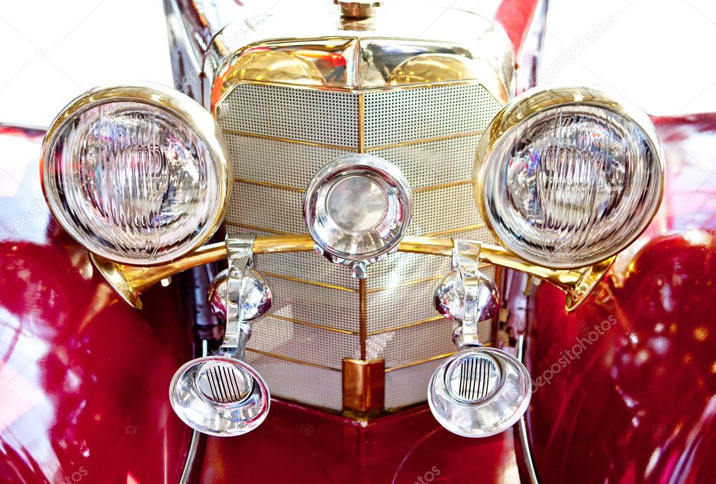 Front headlights of old red car