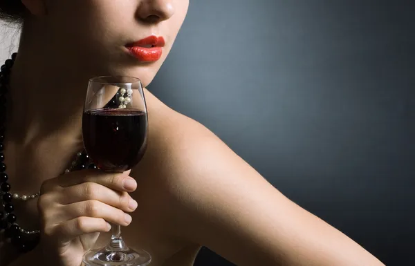 Woman with glass red wine