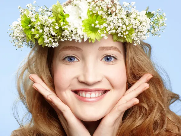 Happy girl with flower crown by Sergey Pristyazhnyuk Stock Photo