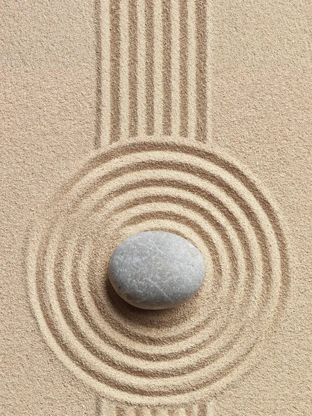 Zen stone in the sand