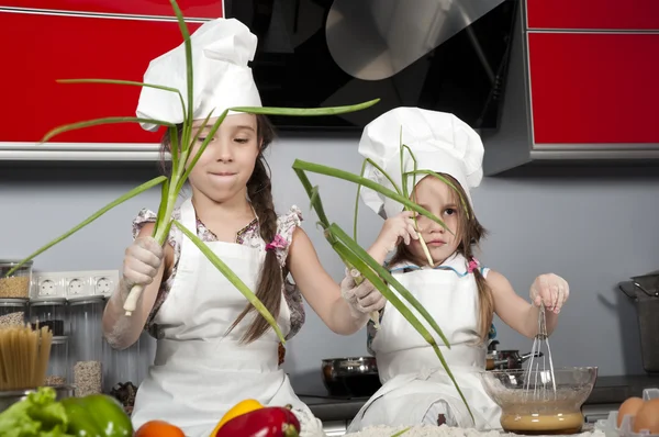 Two little girl cook