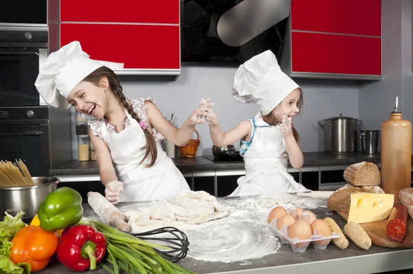 Two little girl cook
