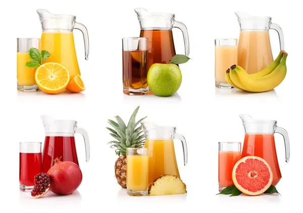 Set of jugs and glasses with tropical fruit juices isolated