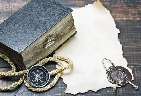 Compass and an old book