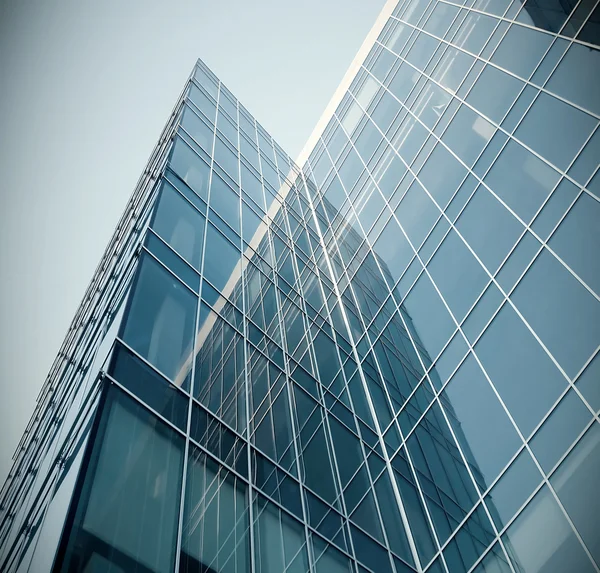 Modern blue glass skyscraper perspective view