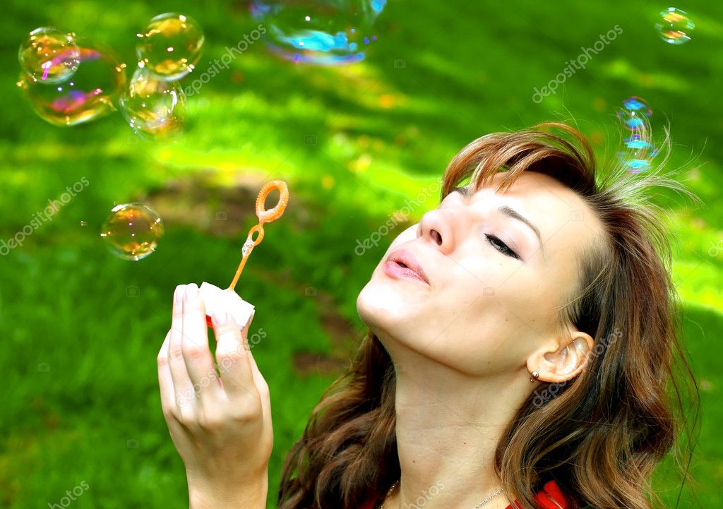 blowing soap bubbles