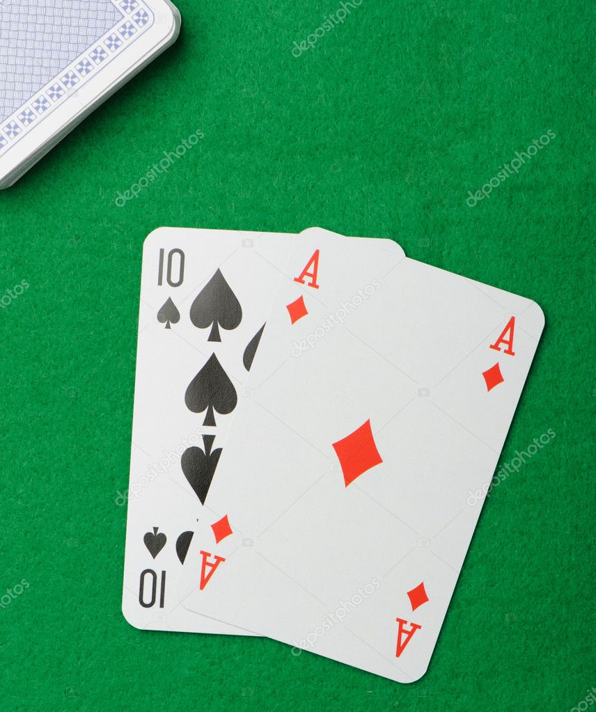 Blackjack.Playing cards on a green background | Stock Photo Y Sergey