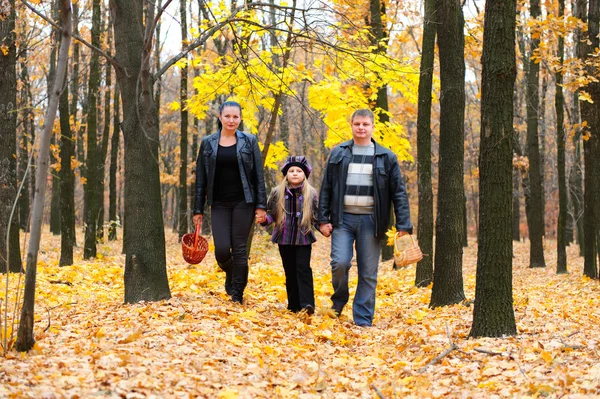 Family in autumn forest — Stock Photo #6540739