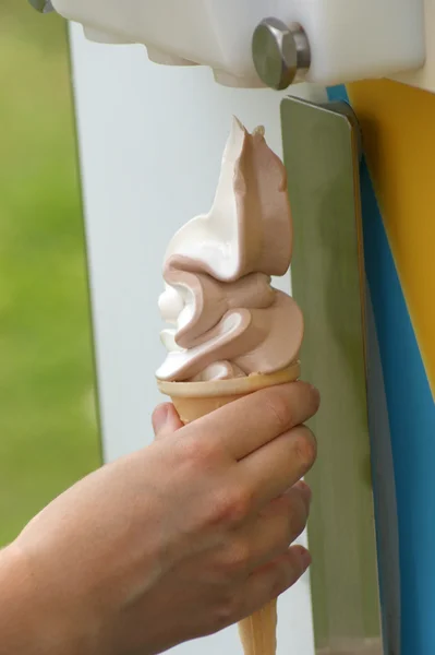 Soft ice cream, vanilla and chocolate on a cone