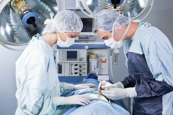 Medical professionals performing an operation