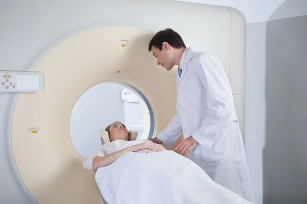 Young woman receiving CT scan