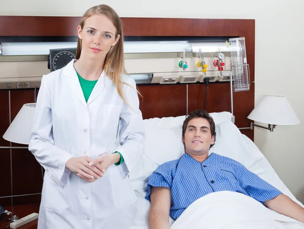 Confident female doctor with patient