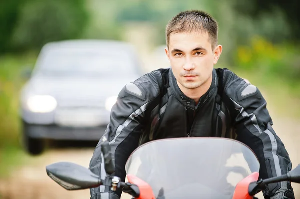 Portrait of man driving motorcycle