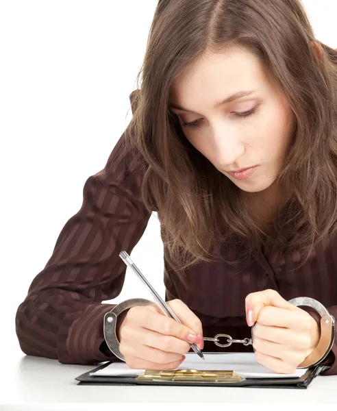 Writing handcuffed woman by Marcin Sadlowski Stock Photo