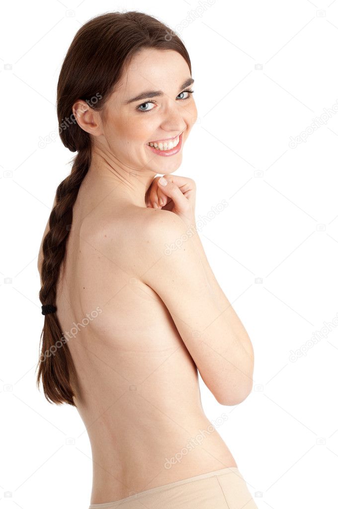 Young naked woman with crossed arms covering breasts