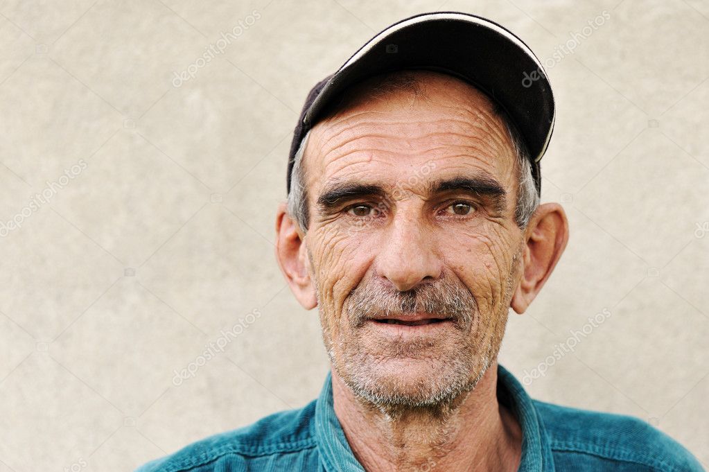 Elderly old mature man with hat portrait