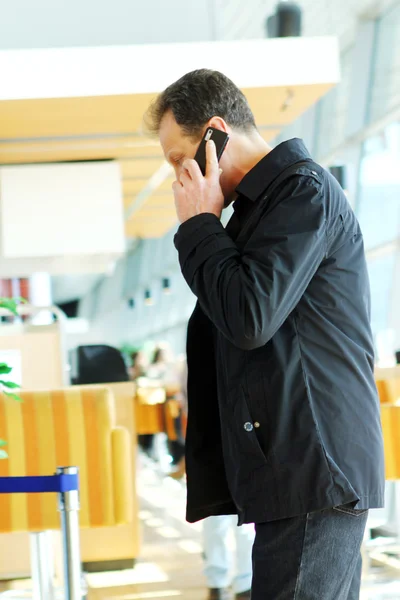 Adult man calling by phone