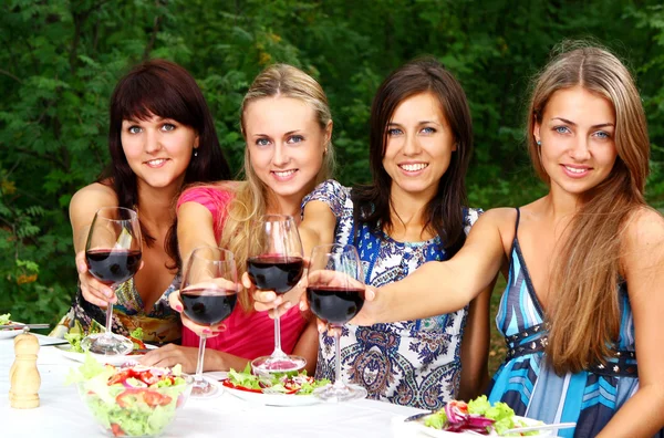 Group of Young Girls Drinking Wine in Park