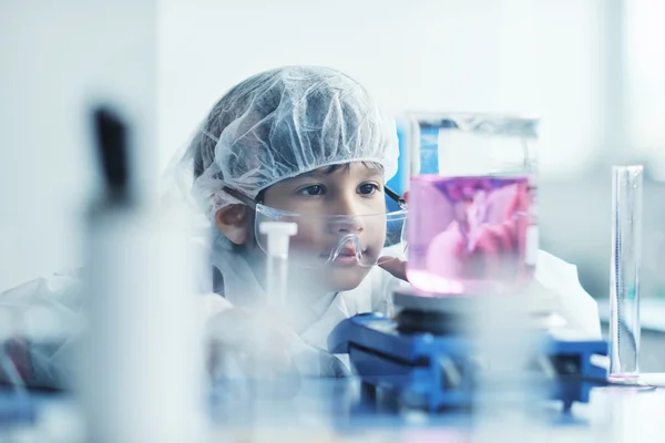 Little child scientist in lab Little child scientist in lab