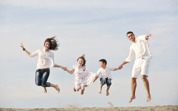 Happy young family have fun on beach