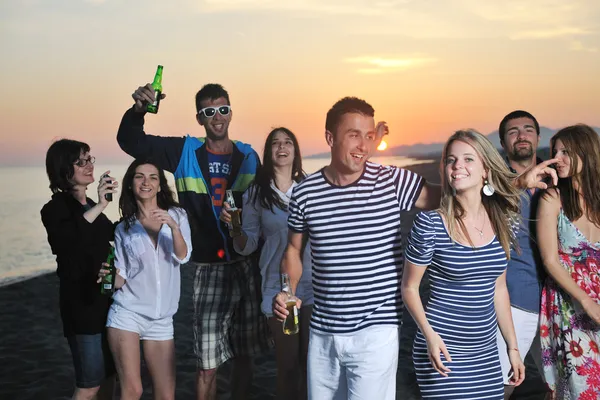 Group of young enjoy summer party at the beach