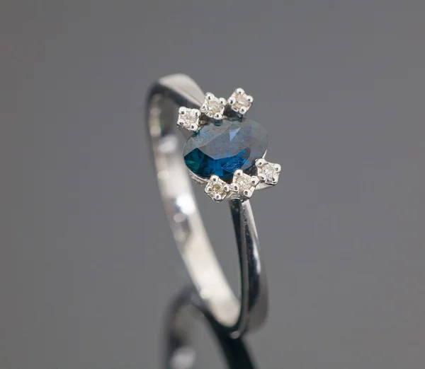 White gold ring with blue sapphire