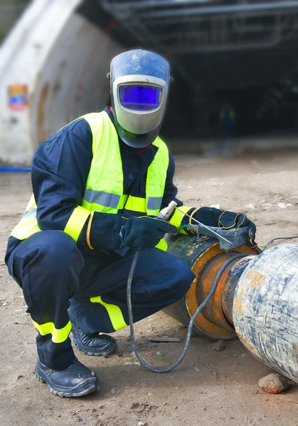 Welder covered with protective mask