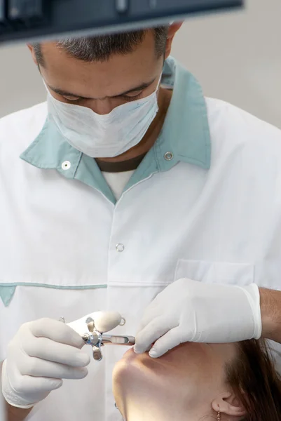 Dentist making anesthetic injection