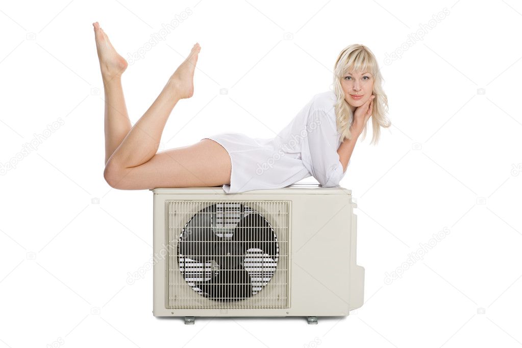 Young girl with a new air conditioner - Stock Image