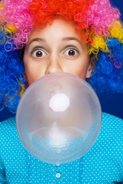 Young girl blowing bubble gum ballon