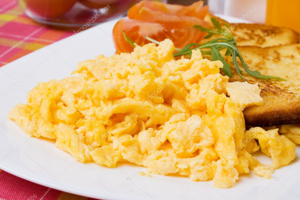 Scrambled eggs and french toast — Stock Photo © igordutina #5664726