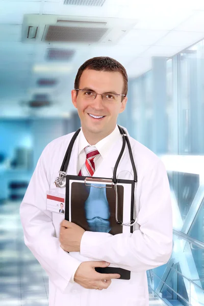 Friendly medical doctor with a x-ray image.