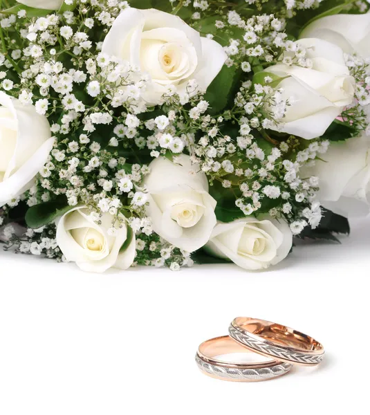 Wedding rings and flowers by Liliia Rudchenko Stock Photo