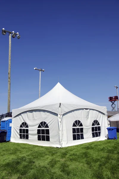 White tent on grass vertical