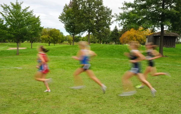 Blurred Girls Cross Country Runners