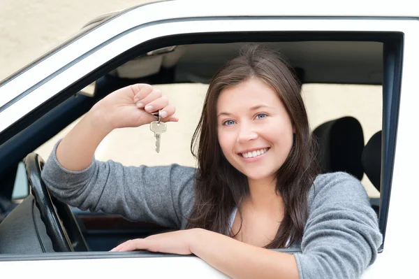 Young woman happy about her new drivers license