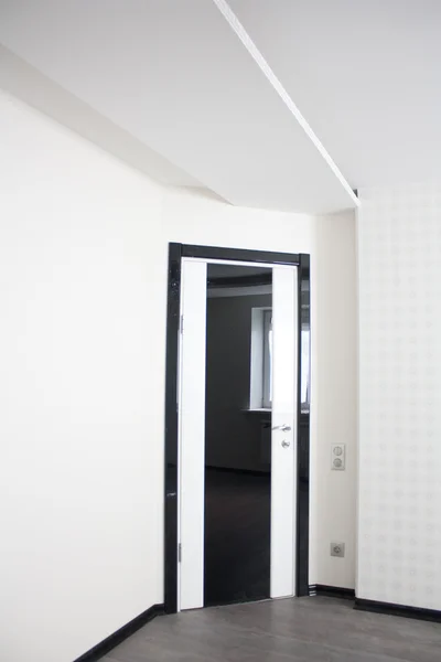White and black door in new flat