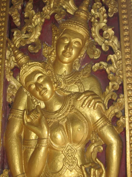 Golden relief of couple