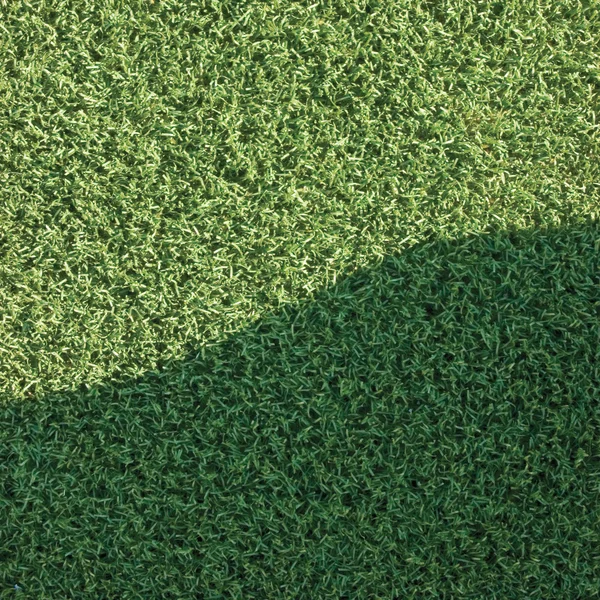 Artificial grass fake turf synthetic lawn field macro closeup - Stock