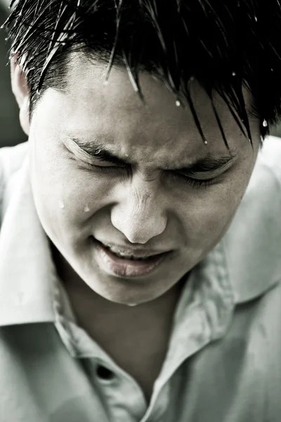 Sad and depressed young asian man