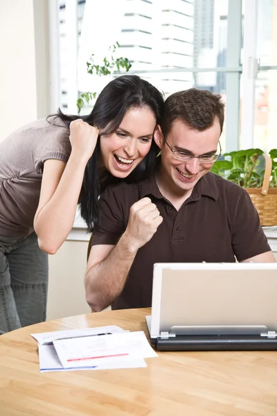 Happy couple online banking