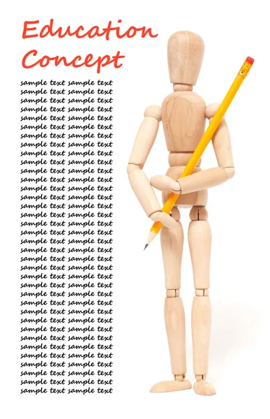 Wooden puppet holding pencil
