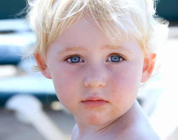 Portrait of young girl or toddler on beach by Nick Stubbs Stock Photo